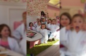 group of girls in white bathrobes