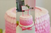 a pink fluffy-iced cake
