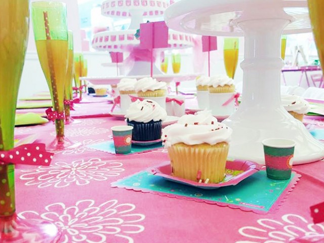 placemats with a cupcake and drink laid out on each