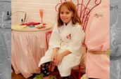 girl sitting with feet in foot spa