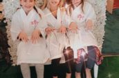 three girls sitting on bench showing off their nails